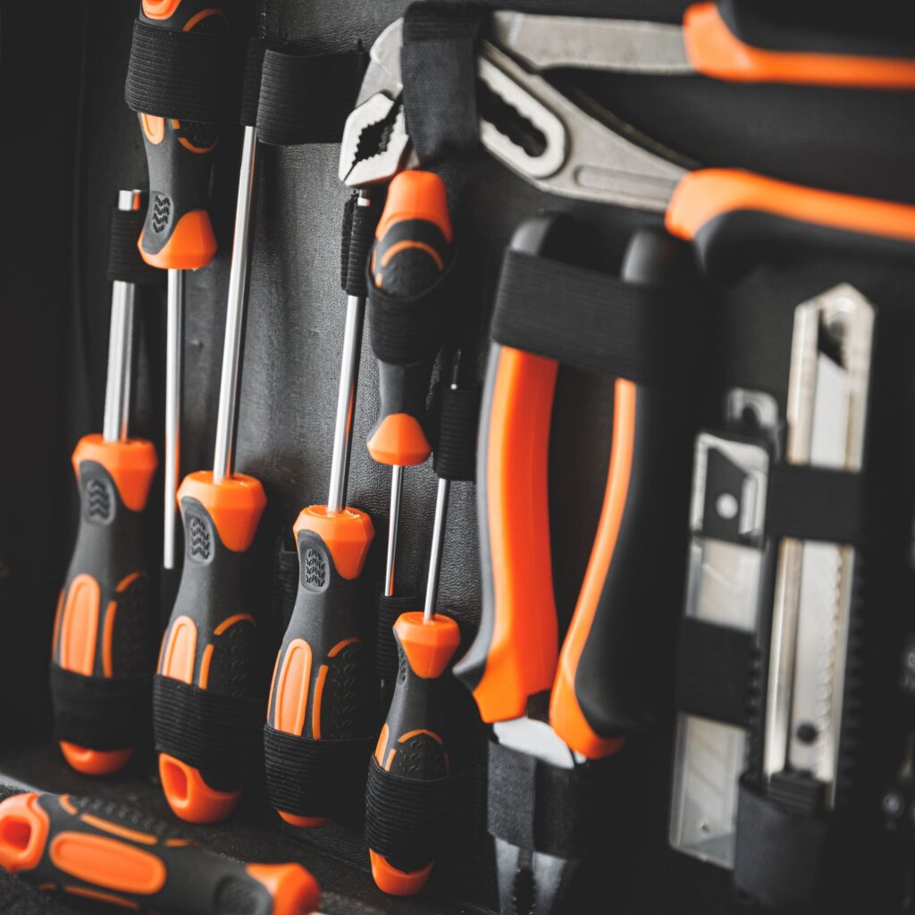 Close-up of the inside of a toolbox with screwdrivers and pliers