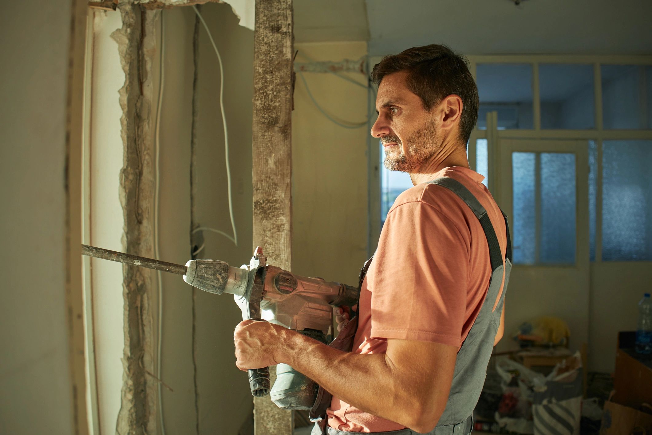 Contractor using a heavy-duty drill during interior construction work